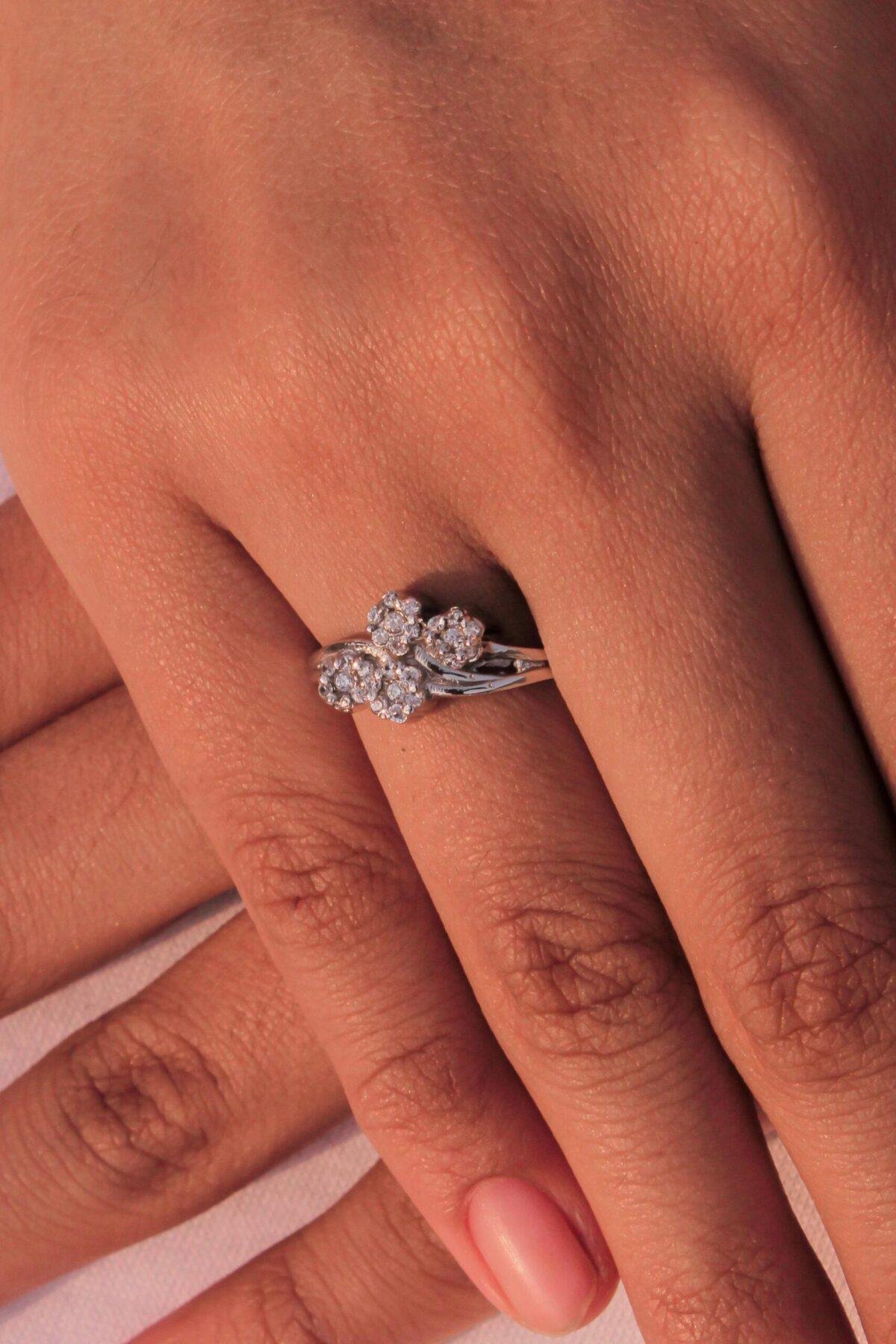 Handcrafted 925 silver Floral Ring adorned with 1.35mm zircon stones, worn by a model