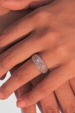 Model's hand adorned with a Glistening Pavé Wedding Band, highlighting its 1.50mm stones and sophisticated design