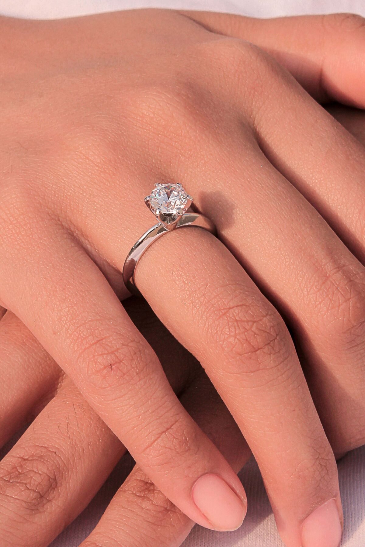 model wearing Floral-Inspired Dome Ring handcrafted in sterling silver with a cubic zircon