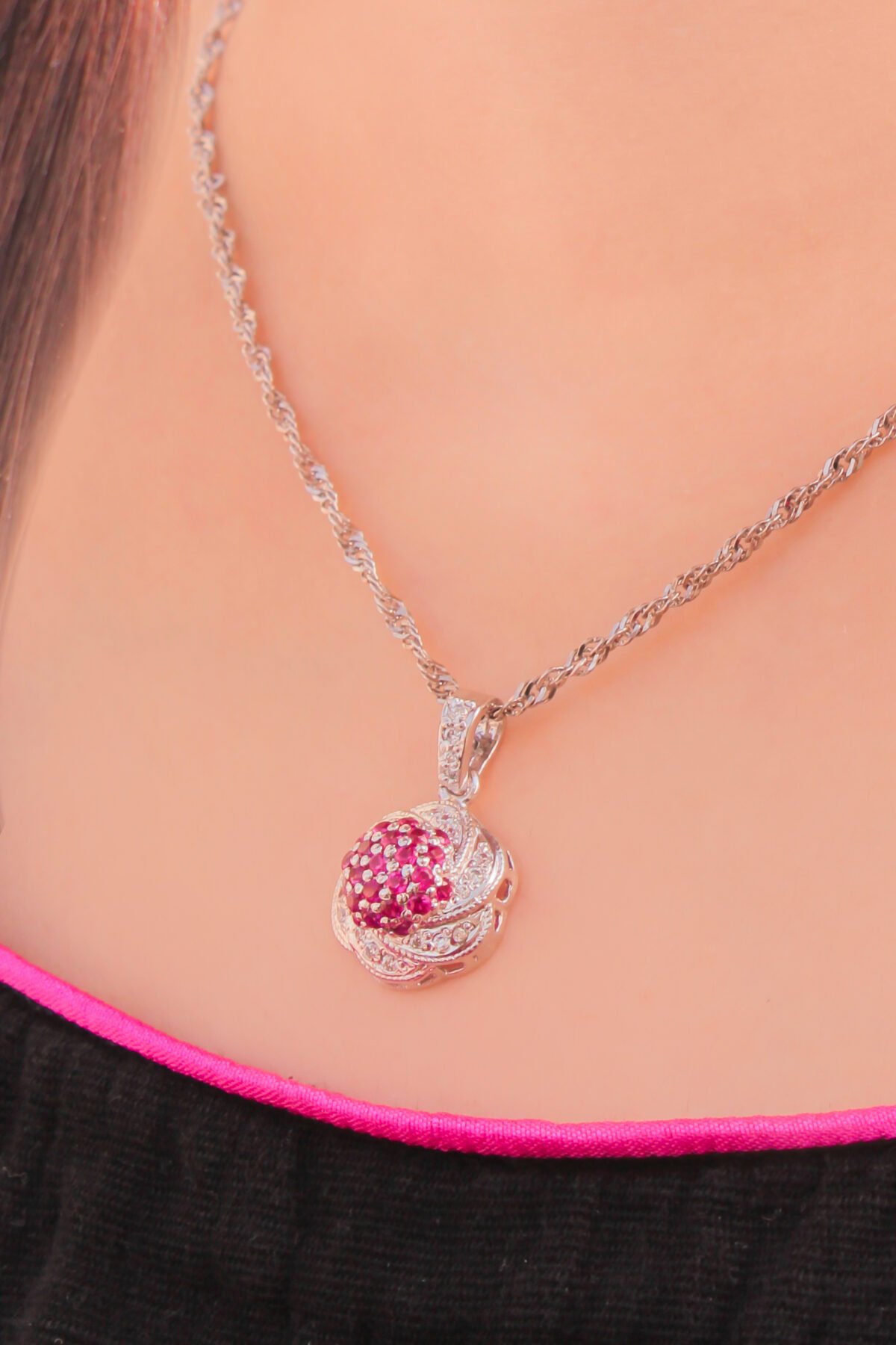 model wearing Pink Floral Cluster Pendant with Rhodium Plating & crafted in silver