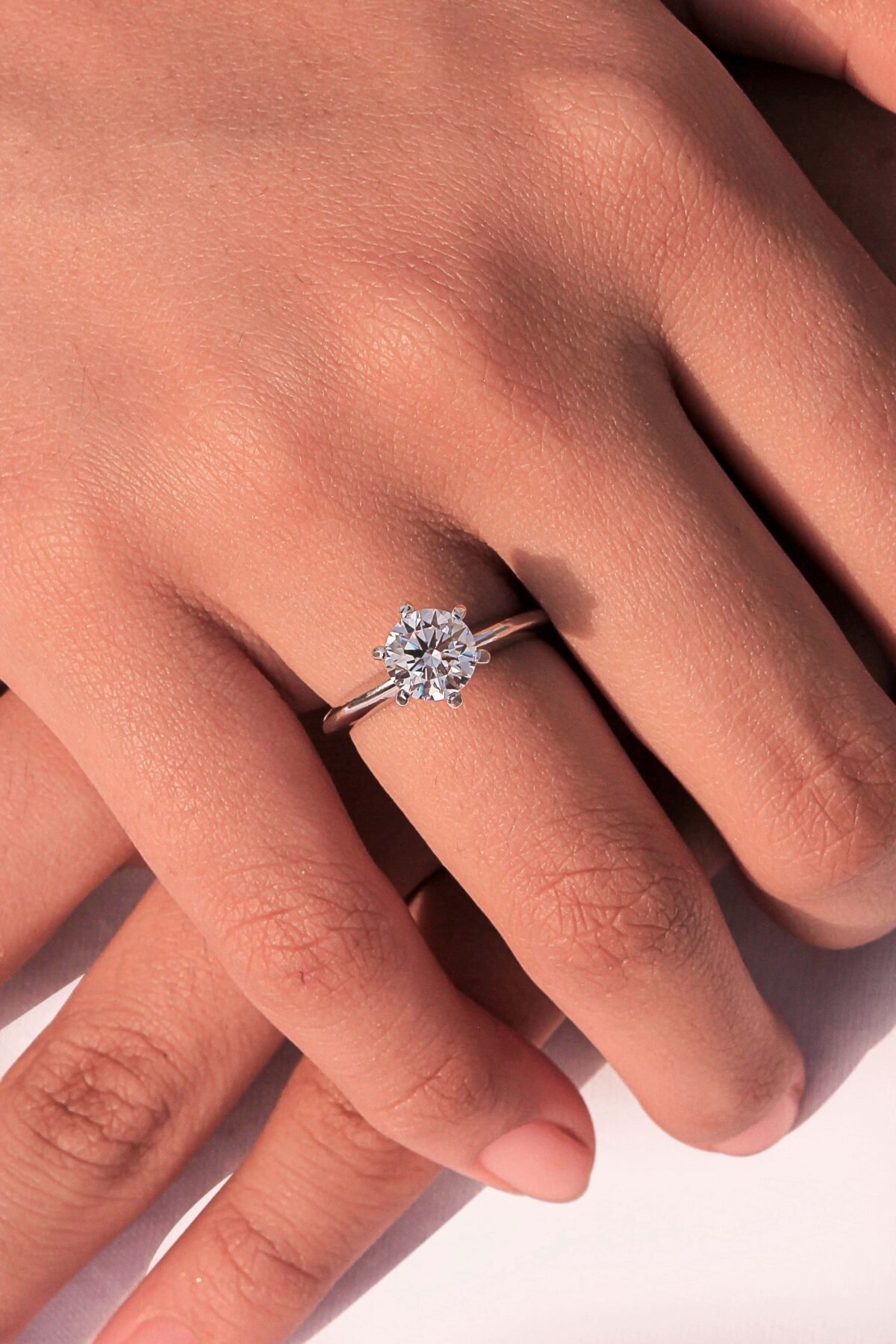 women holding Floral-Inspired Dome Ring handcrafted in sterling silver with a cubic zircon