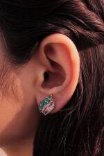 model wearing Enchanting Leaf Earrings 2.4mm green stones crafted in 925 silver