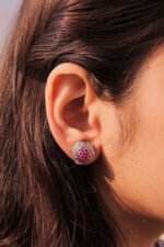 model wearing Sparkling Cluster Twist Earrings 1.75mm center pinkish stones with rhodium plating