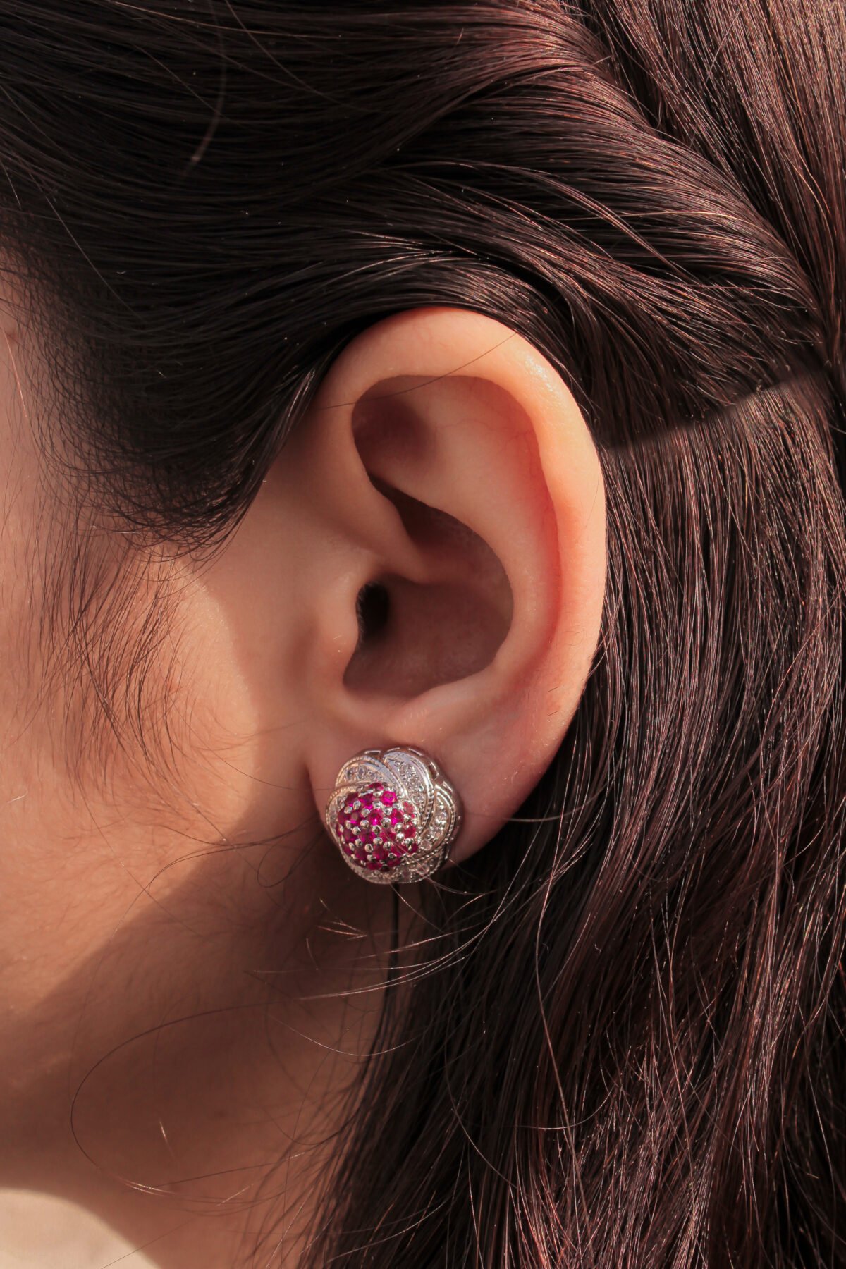 model wearing Sparkling Cluster Twist Earrings 1.75mm center pinkish stones_