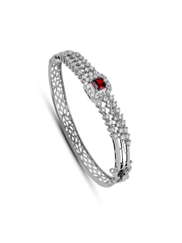 Rustic Garnet Bracelet with a 4.5mm red-orange garnet centerpiece, surrounded by zircon accents, crafted from 925 sterling silver with a rhodium finish