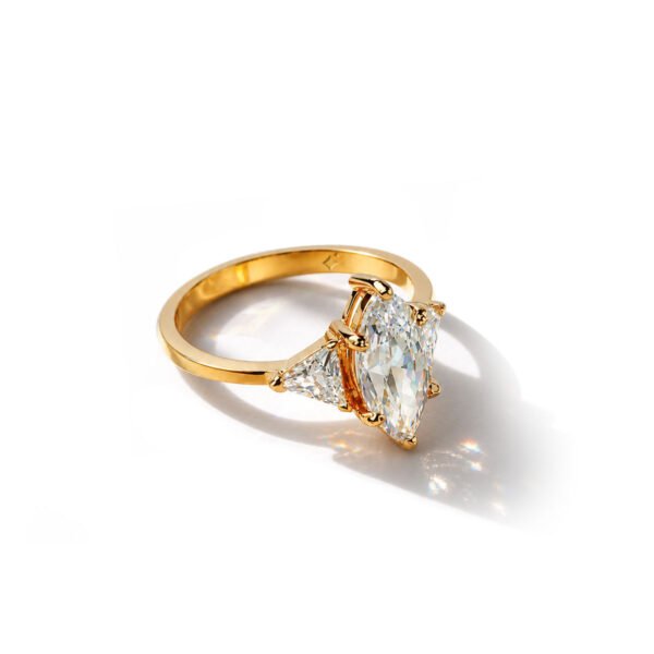 top side view of 3 Carat Marquise Trio Ring with Side Trillion Stones in gold finish