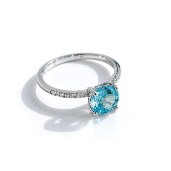 Shop the Ice Cut Blue Solitaire Ring crafted in 925 sterling silver with rhodium plating and a brilliant ice blue stone
